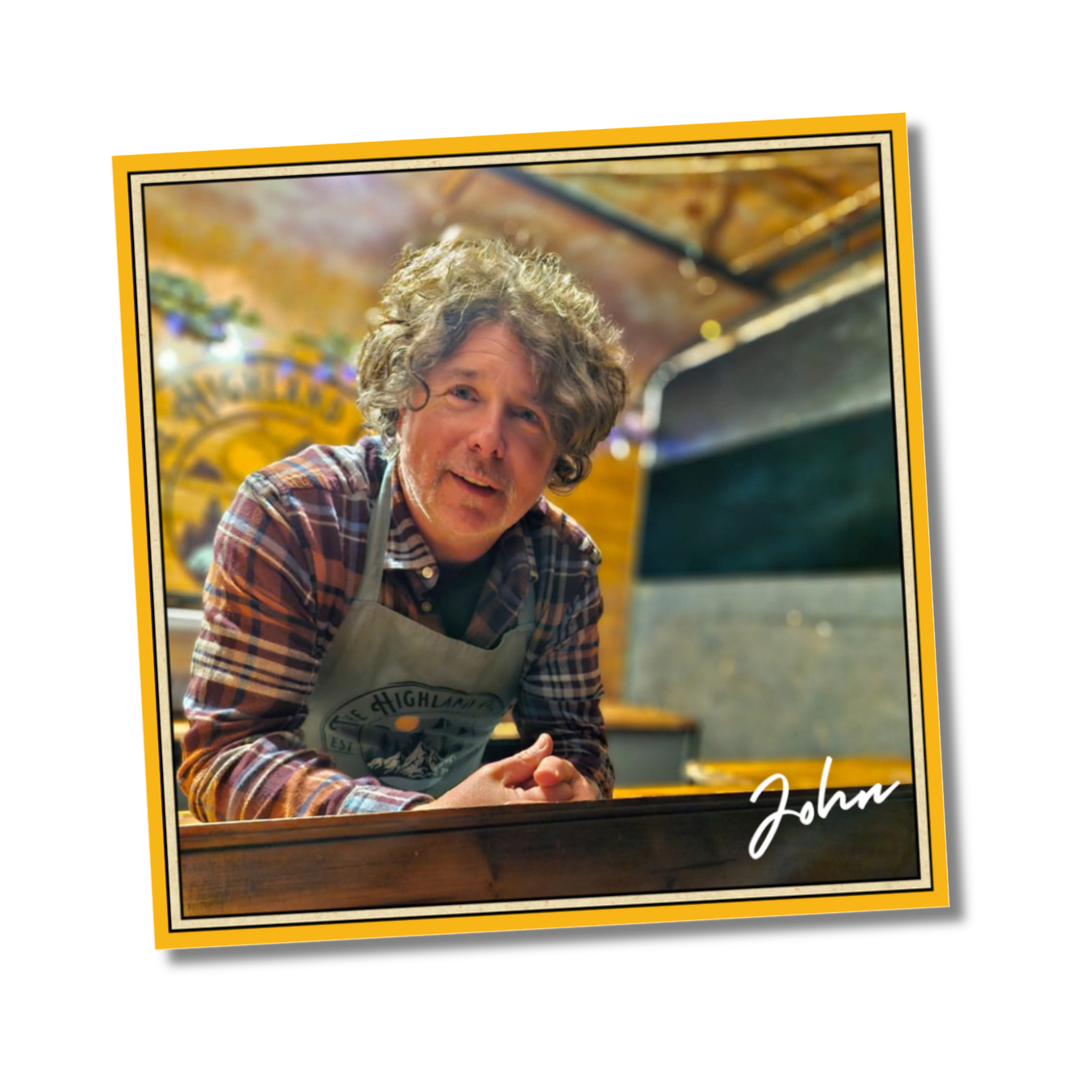an image of John owner and chef standing at the counter of the Highland Crepe and Coffee Co Trailer smiling.
